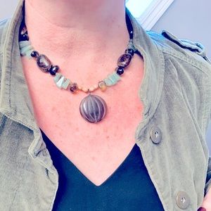 One of a kind crystal and wood bead necklace.